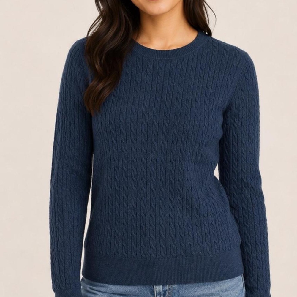 Blue cable knit crewneck sweater in a soft, classic style